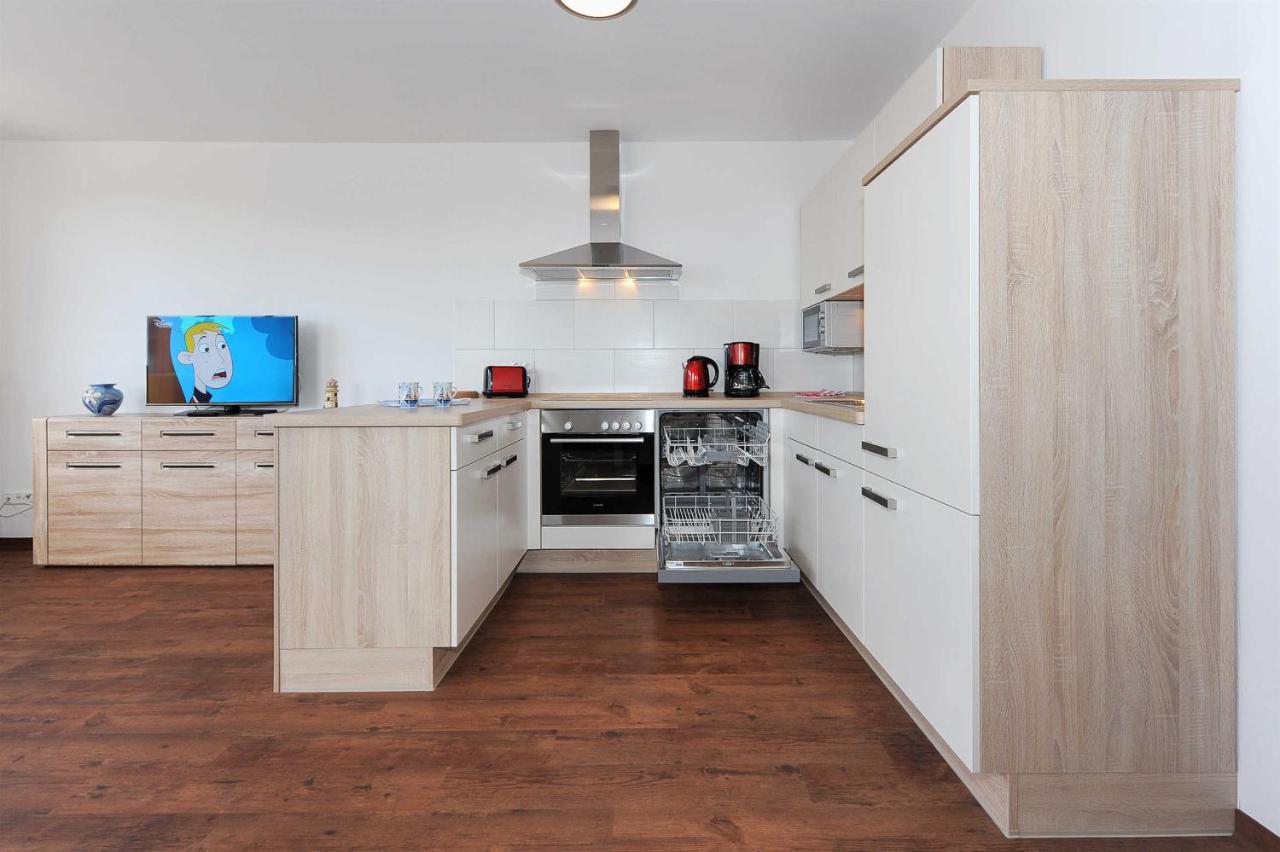 Haus Leuchtturm Apartment Bensersiel Bagian luar foto